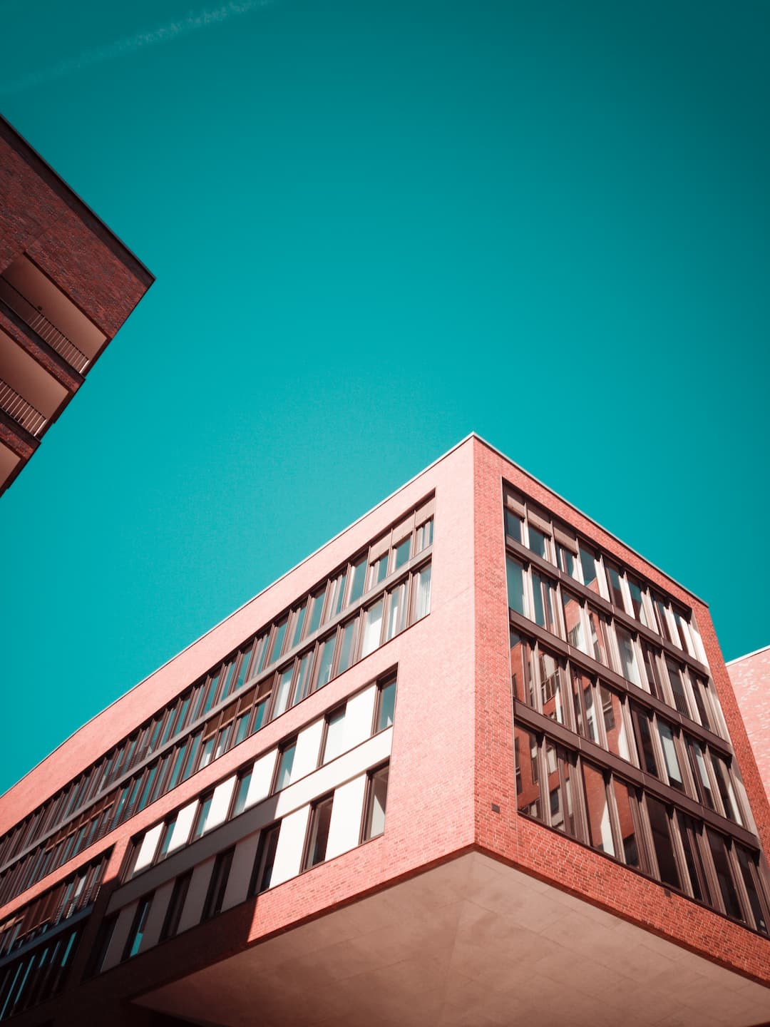 low-angle-photography-red-concrete-building